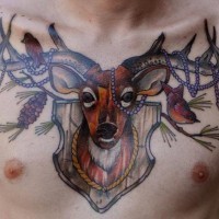 Marvelous looking colored deer head tattoo on chest combined with birds