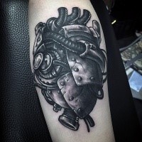 Marvelous looking detailed black ink forearm tattoo of human biomechanical heart