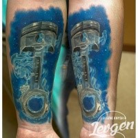 Marvelous multicolored forearm tattoo of very detailed car piston