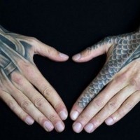 Marvelous very detailed black ink medieval armor tattoo on hands and finger