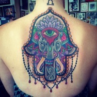 Marvelous very detailed colorful Hamsa hand tattoo on whole back stylized with elephant
