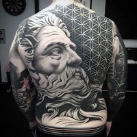 Massive black and white antic statue with tribal ornaments tattoo on whole back