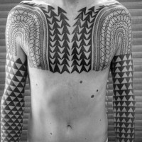 Massive black and white geometrical ornaments tattoo on chest and sleeve