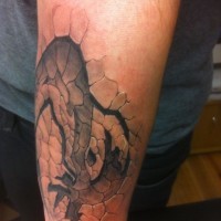 Massive black and white mystical print on corrupted ground tattoo on arm