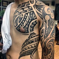 Massive black and white simple Polynesian ornaments tattoo on chest and shoulder