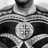 Massive black and white tribal style tattoo with mystic symbol on chest and shoulder
