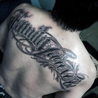 Massive black and white wonderful lettering tattoo on upper back