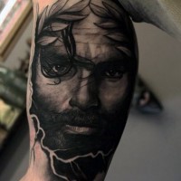 Massive black ink antic detailed portrait tattoo on arm