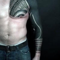 Massive black style tattoo on sleeve and chest