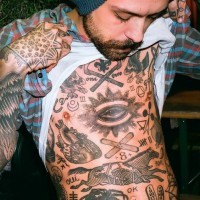 Massive colored various styles tattoo on whole body