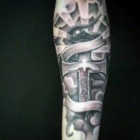 Massive designed cross with Virgin Mary religious forearm tattoo with banner and white pigeon