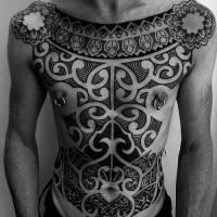 Massive detailed tribal ornaments tattoo on whole chest and belly