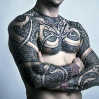 Massive fantasy armor like colored tattoo on chest and sleeve