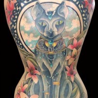 Massive multicolored Egypt cat tattoo on whole back stylized with various flowers