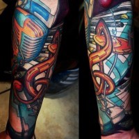 Massive multicolored music themed tattoo with various instruments on sleeve