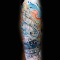 Massive multicolored old ship with lettering tattoo on sleeve