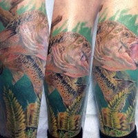 Massive multicolored realistic looking fish tattoo on leg