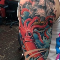 Massive red colored evil squid attacking the ship tattoo on half sleeve zone
