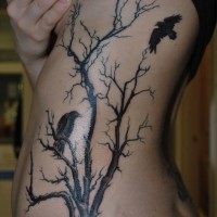 Massive tattoo of awesome dark tree with crows