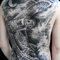 Massive very realistic looking flying owl in night forest tattoo on whole back