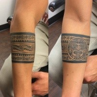 Mayan style black ink forearm tattoo of old ornament