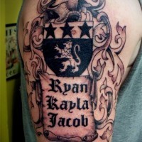 Medieval family crest tattoo on shoulder