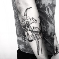 Medium black ink detailed forearm tattoo of various flowers