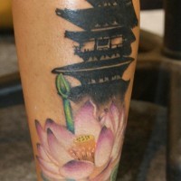 Medium black ink old Asian temple tattoo on leg combined with colored flower