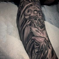 Medium side black ink fantasy monster skeleton tattoo on leg