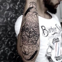 Medium size black ink forearm tattoo of interesting designed eagle