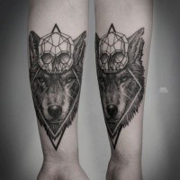 Medium size black ink forearm tattoo of large wolf with diamond skull