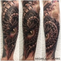 Medium size colored arm tattoo of mystical looking eye with bones