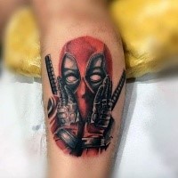Medium size detailed cute Deadpool portrait tattoo on leg
