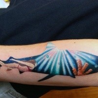 Medium size shark shaped forearm tattoo stylized with swimming woman under water