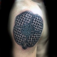 Medium size stylized with Celtic knot clover leaf shaped tattoo on arm top
