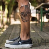 Medium size Valentin Hirsch symmetrical tattoo on leg