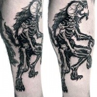 Medium sized black ink colored leg tattoo of wolverine skeleton