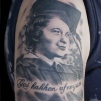 Memorial style black and white collage boy tattoo on shoulder with lettering