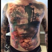 Memorial style colored whole chest and belly tattoo of soldier combined with woman portrait