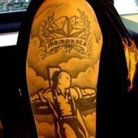 Memorial tattoo on shoulder
