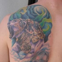Menacing bear in armor tattoo on shoulder blade