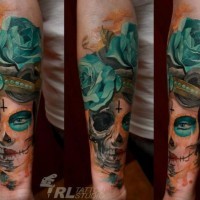 Mexican native designed colored woman portrait tattoo on forearm with blue rose
