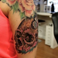 Mexican native shoulder tattoo of human skull with butterfly