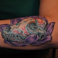Mexican style colored arm tattoo of animal skull with violet flower