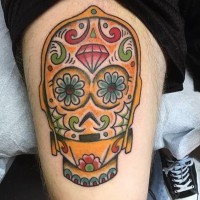 Mexican style deigned and colored big C3PO head tattoo on thigh