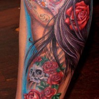 Mexican style multicolored smoking woman with flowers tattoo on leg