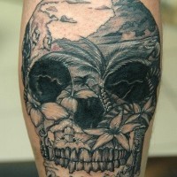 Mexican traditional black ink skull tattoo on leg stylized with wild island shore
