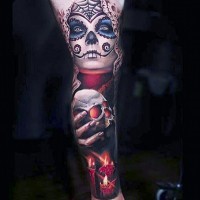 Mexican traditional colored leg tattoo of creepy witch with candle and human skull