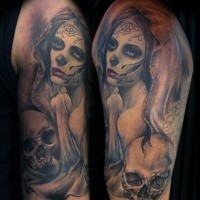 Mexican traditional colored shoulder tattoo of woman portrait and skulls