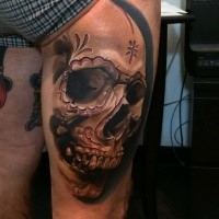 Mexican traditional colored thigh tattoo of human skull